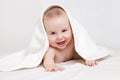 Happy baby under white blanket Royalty Free Stock Photo