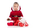 Happy baby wearing red Christmas Santa suit, on a white background Royalty Free Stock Photo