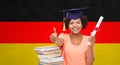 Happy bachelor girl with diploma showing thumbs up Royalty Free Stock Photo