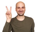 Happy bald guy showing victory sign