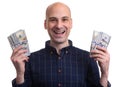 Happy bald man is holding money