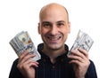 Happy bald man is holding some money. Isolated