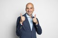 Happy bald man showing his thumbs up. Isolated Royalty Free Stock Photo
