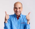Happy bald man showing thumbs up. Isolated Royalty Free Stock Photo