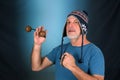 happy bald man with white beard Peruvian cap on his head playing musical instrument asalato looking forward with good expression