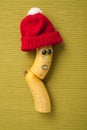 Happy banana in red hat