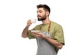 Happy barista or waiter in apron drinking coffee Royalty Free Stock Photo