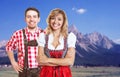Happy bavarian man with leather pants and beautiful blonde woman Royalty Free Stock Photo
