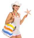 Happy beach young woman holding starfish Royalty Free Stock Photo