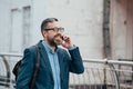 happy beard stylish businessman talking on smartphone