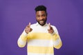 Happy bearded african american man smiling and pointing at camera Royalty Free Stock Photo