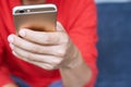 Happy bearded African businessman using phone while sitting on sofa Royalty Free Stock Photo