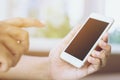 Happy bearded African businessman using phone while sitting on sofa Royalty Free Stock Photo