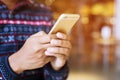 Happy bearded African businessman using phone while sitting on sofa Royalty Free Stock Photo