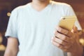 Happy bearded African businessman using phone while sitting on sofa Royalty Free Stock Photo