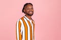 Happy bearded afro-american man with dreadlocks in stylish striped shirt and eyeglasses looking at camera and smiling, optimism Royalty Free Stock Photo