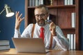 happy bearded business man holding credit card and using laptop computer typing on keyboard enter code for Online shopping from Royalty Free Stock Photo