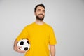 happy bearded football fan holding soccer Royalty Free Stock Photo