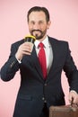Happy bearded man in blue suite and red tie drinking coffee. Businessmen in travel Royalty Free Stock Photo