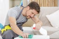 happy bearded man cleaning table