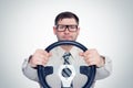 Happy bearded man in glasses with steering wheel, car driver concept Royalty Free Stock Photo