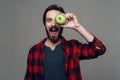 Happy bearded man hold Apple and looking at Camera Royalty Free Stock Photo