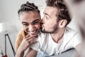 Happy bearded man kissing his girlfriend Royalty Free Stock Photo