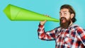 Happy bearded man with paper loudspeaker. Season sale. Male with megaphone. Advertising concept.