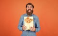 Happy bearded man with present box. cheerful brutal hipster hold gift. boxing day. birthday surprise at party. after