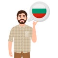 Happy bearded man says or thinks about the country of Bulgaria, European country icon, traveler or tourist