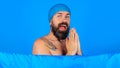 Happy bearded man take shower. Handsome male in bath hat. Relaxes time. Guy showering. Body washing. Royalty Free Stock Photo