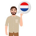 Happy bearded man talking or thinking about the country of the Netherlands, European country icon, traveler or tourist