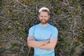 happy bearded mature man in summer shirt on plant wall background, summer style Royalty Free Stock Photo