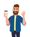 Happy bearded trendy man holding a coffee cup and showing, gesturing or making okay, OK sign with hand fingers. Male character. Royalty Free Stock Photo