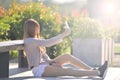 Happy beatuiful asian waman with smartphone sit in garden. Royalty Free Stock Photo