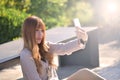 Happy beatuiful asian waman with smartphone sit in garden. Royalty Free Stock Photo