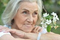 Beautifil elderly woman posing in autumn park Royalty Free Stock Photo