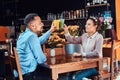 Happy beautiful African-American couple in love having a great time together in a restaurant at their dating, an Royalty Free Stock Photo