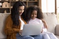 Happy beautiful African American family using computer. Royalty Free Stock Photo