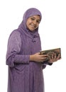 Happy Beautiful Arab Muslim Girl in Islamic Fashion Dress Holding Holy Book of Quran With Happy Smily Face