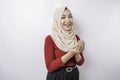 Happy beautiful Asian Muslim girl wearing a headscarf praying to God Royalty Free Stock Photo