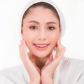 Happy beautiful Asian woman with healthy facial skin and treatment face skincare for fresh clean clear natural in a beauty spa Royalty Free Stock Photo