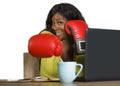 Happy beautiful black afro American woman in boxing gloves smiling cheerful working at office computer desk posing as successful e Royalty Free Stock Photo