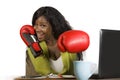 Happy beautiful black afro American woman in boxing gloves smiling cheerful working at office computer desk posing as successful e