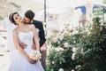 Happy and beautiful bride and groom kissing Royalty Free Stock Photo