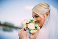 Happy and beautiful bride tender at spring outdoors at the beach Royalty Free Stock Photo