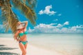 Happy beautiful carefree woman enjoying sunshine on the beach. Young woman in red pink bikini in white sandy beach at Maldive Royalty Free Stock Photo