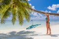 Happy beautiful carefree woman enjoying sunshine on the beach. Young woman in red pink bikini in white sandy beach at Maldive Royalty Free Stock Photo