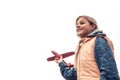 Happy beautiful child girl with toy airplane on white sky background looking with inspiration concept for start career Royalty Free Stock Photo