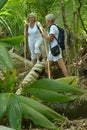 Happy elderly couple in tropical forest Royalty Free Stock Photo